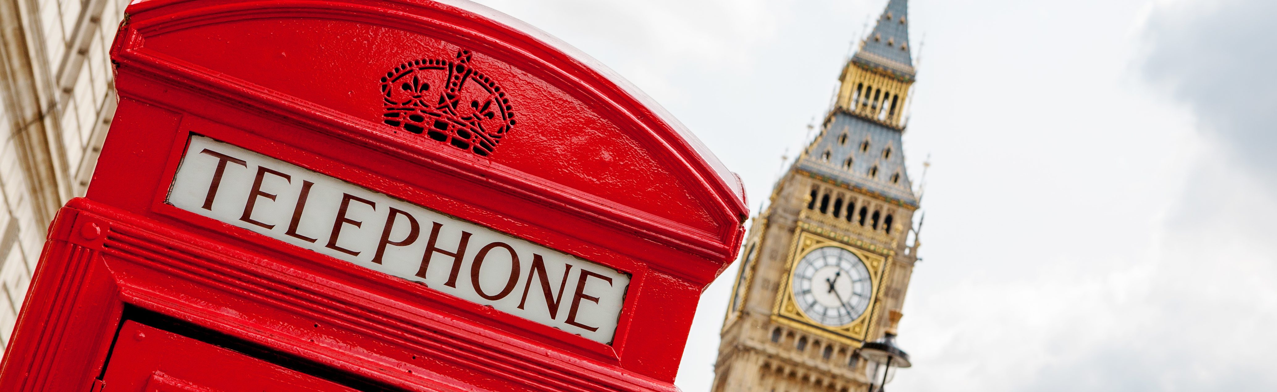 Red telephone box near Big Ben. London, England